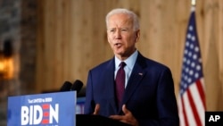 FILE - Democratic presidential candidate former Vice President Joe Biden speaks to local residents during a community event, Aug. 7, 2019, in Burlington, Iowa. 