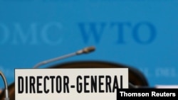FILE PHOTO: A sign is pictured in front of the chair of the Director General before the start of the General Council of the World Trade Organization (WTO) in Geneva