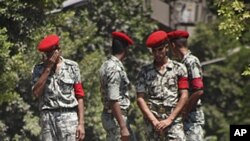 Egyptian protesters shout anti-Israeli slogans in front of military vehicle near the Israeli embassy in Cairo, August 20, 2011, as they protest the deaths of Egyptian security forces killed in a shootout between Israeli soldiers and Palestinian militants 