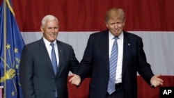 Indiana Gov. Mike Pence joins Republican presidential candidate Donald Trump at a rally in Westfield, Ind., July 12, 2016.