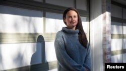 Mental health toll of the pandemic on frontline healthcare workers: ER doctor Anne Messman poses for a photo amid a coronavirus disease (COVID-19) outbreak in Detroit, Michigan, U.S., May 6, 2020.