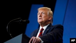 FILE - President Donald Trump speaks at the 2019 House Republican Conference Member Retreat Dinner in Baltimore, Sept. 12, 2019. 