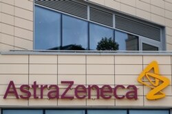 FILE - AstraZeneca offices and its corporate logo are seen on a building in Cambridge, Britain, July 18, 2020.