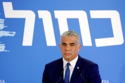 FILE - Yair Lapid, head of Yesh Atid, holds a news conference in Tel Aviv, Israel, Feb. 21, 2019.