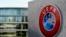 A man walks inside the headquarters of European football body UEFA in Nyon on April 6, 2016. Swiss police raided the UEFA headquarters on April 6 following the latest revelations of a web of Panama-based offshore financial dealings by the rich and famous.