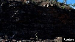 An indigenous soldier in Australia's Northern Territory July 18, 2013. A mining company was fined for damaging a nearby Aboriginal site.