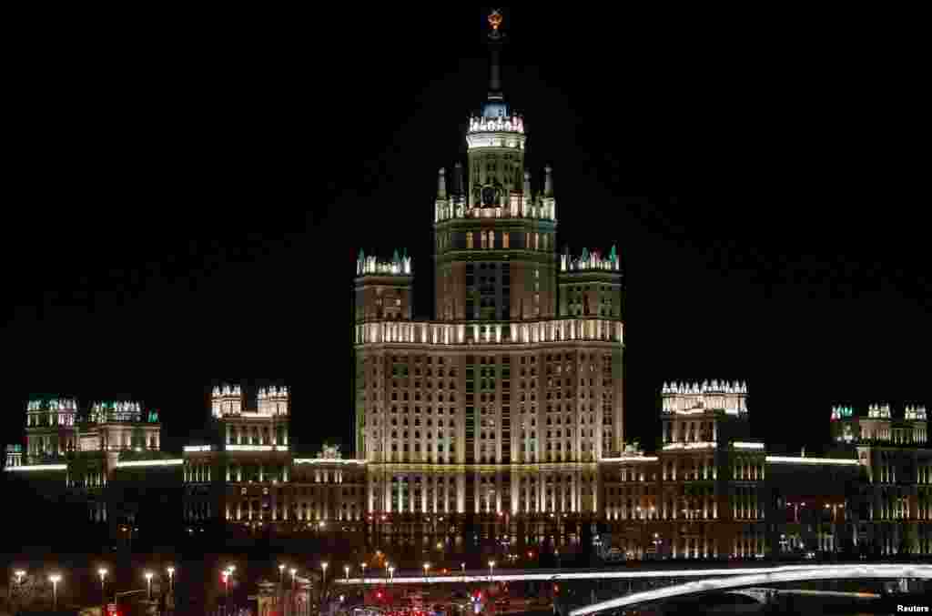 Stalin's era skyscraper is seen before the lights are switched off for Earth Hour in Moscow, March 30, 2019.