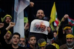 Supporters of Hezbollah leader Sayyed Hassan Nasrallah chant slogans in a southern suburb of Beirut, Lebanon, Jan. 5, 2020, following the U.S. airstrike in Iraq that killed Iranian Revolutionary Guard Gen. Qassem Soleimani.