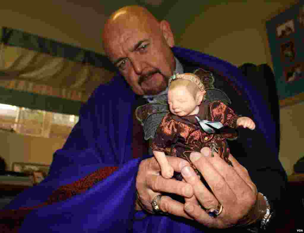 &ldquo;The girls love playing with this,&rdquo; Hogg says as he holds a popular fairy doll. &quot;Children have a far stronger sense of the truth of what&rsquo;s going on ... they just sense it.&rdquo;&nbsp;(Photo by Darren Taylor) &nbsp;​