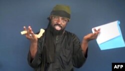 This screen grab image taken on February 18, 2015 from a video made available by Islamist group Boko Haram shows its leader, Abubakar Shekau, making a statement at an undisclosed location.