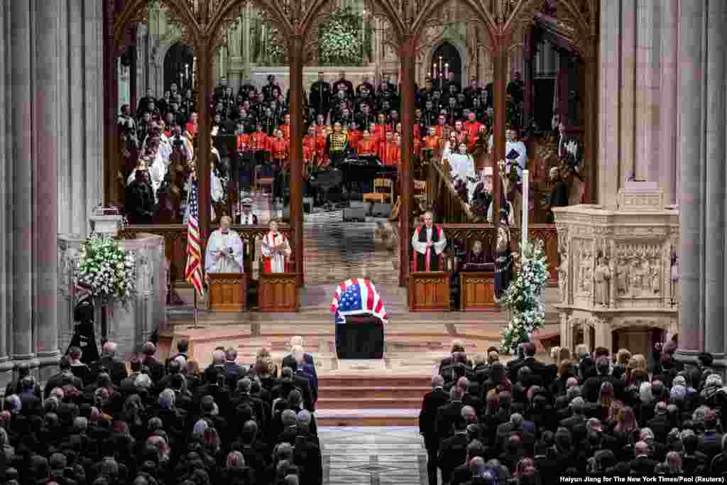 The casket of former President Jimmy Carter arrives at the National Cathedral in Washington, for a procession before the funeral.