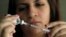 FILE - Judith Garcia, 19, fills a syringe as she prepares to give herself an injection of insulin at her home in Commerce, California, April 29, 2012