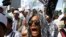 FILE - Members of the militant Islamic Defenders Front (FPI) shout slogan during a demontration in Jakarta, Indonesia.