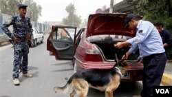 Polisi Irak meningkatkan pemeriksaan keamanan di pusat kota Baghdad (23/6).