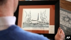  In this Jan. 10, 2019 photo, Steve O'Brien holds an editorial cartoon framed with his boarding pass from US Airways Flight 1549 that eventually crash-landed in the Hudson River on Jan. 19, 2009 as he poses for a photo at his home in Charlotte, N.C. 