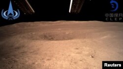 FILE - The far side of the moon, photographed by the Chang'e-4 lunar probe, is seen in this image provided by China National Space Administration, Jan. 3, 2019.
