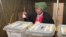FILE - A woman casts her vote in presidential and parliamentary elections in Zimbabwe's capital, Harare, July, 31, 2013. Four women are among the presidential candidates seeking election on Monday.