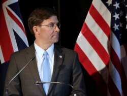FILE - U.S. Secretary of Defense Mark Esper briefs the media following annual bilateral talks with Australian counterparts in Sydney, Australia, Aug. 4, 2019.