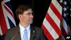 FILE - U.S. Secretary of Defense Mark Esper briefs the media following annual bilateral talks with Australian counterparts in Sydney, Australia, Aug. 4, 2019. 