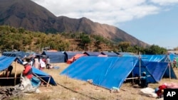 Makeshift tents are erected to be used as a temporary shelter for those affected by an earthquake in Sembalun, Lombok Island, Indonesia, Aug. 6, 2018.