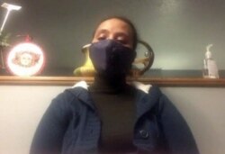 Seblewongel Alemu, recovering from COVID-19, wants to make sure enhanced safety measures are in place before she returns to work at Smithfield Foods in Sioux Falls, South Dakota. She is shown here in a Skype screen grab.