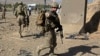 U.S. troops, part of the NATO-led International Security Assistance Force (ISAF), arrive at the site of a suicide attack in Maidan Shar, the capital of Wardak province, Afghanistan, Sep. 8, 2013. 