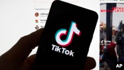Le logo de TikTok est visible sur un téléphone portable devant un écran d'ordinateur qui affiche l'écran d'accueil de TikTok, le samedi 18 mars 2023, à Boston. (AP Photo/Michael Dwyer, File).