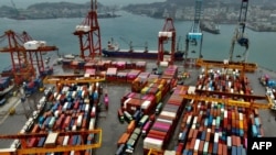 FILE - Shipping containers are seen at the harbor in Keelung, Taiwan, Dec. 8, 2020.