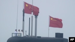 In this April 23, 2019, file photo, a new type 094A Jin-class nuclear submarine Long March 10 of the Chinese People's Liberation Army (PLA) Navy participates in a naval parade to commemorate the 70th anniversary of the founding of China's PLA Navy.