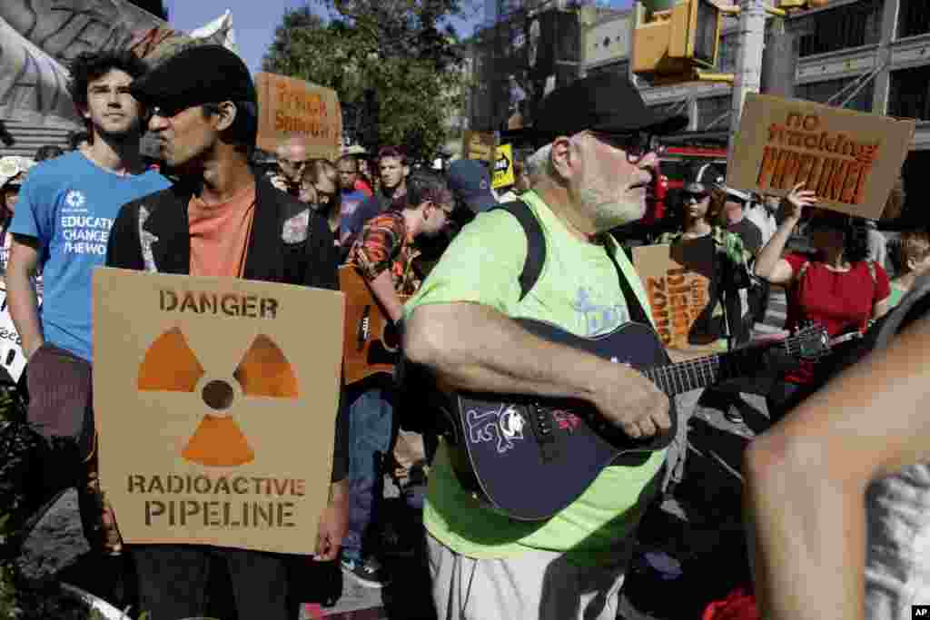 Protesters associated with the Occupy Wall Street movement march in protest of the natural gas drilling technique known as "fracking" in New York, New York, September 16, 2012.