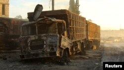 Damaged aid trucks are pictured after an airstrike on the rebel held Urm al-Kubra town, western Aleppo city, Syria Sept. 20, 2016. 
