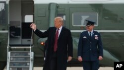 President Donald Trump walks to board Air Force One at Andrews Air Force Base, Md., Saturday, Jan. 19, 2019, to travel to Dover Air Force Base, Del.