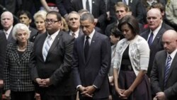 President Obama and his wife, Michelle, at the memorial service. Next to the president is Daniel Hernandez, 20, an intern who rushed to the aid of Rep. Gabrielle Giffords. Next to the first lady is the congresswoman's husband, NASA astronaut Mark Kelly.