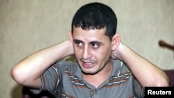 Saad Khalaf Ali, one of the 69 hostages rescued from an Islamic State prison in a joint raid by U.S. and Kurdish special forces, speaks during an interview with Reuters in Irbil, Iraq, Oct. 29, 2015. 