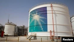 FILE - An Aramco oil tank is seen at the production facility at Saudi Aramco's Shaybah oilfield in the Empty Quarter, Saudi Arabia, May 22, 2018.