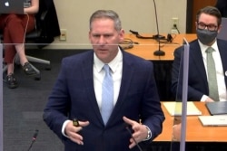 Prosecutor Steven Schleicher makes closing arguments as defense attorney Eric Nelson listens during the trial of former Minneapolis police officer Derek Chauvin for second-degree murder.