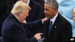 FILE - President Donald Trump points at Former President Barack Obama after his speech during the 58th Presidential Inauguration at the U.S. Capitol in Washington, Friday, Jan. 20, 2017. (AP Photo/Andrew Harnik)