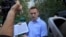 FILE - Russian opposition leader Alexei Navalny speaks with journalists in Moscow, Russia, Sept. 8, 2019.