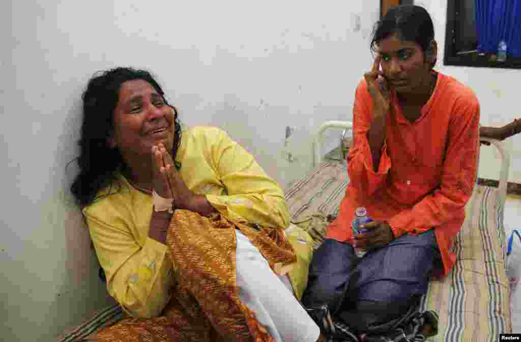 A suspected asylum seeker cries after finding out about the death of her husband, at Jayanti beach clinic in West Java, Indonesia, July 24, 2013.