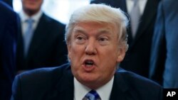 Donald Trump dans le bureau oval le 24 mars 2017. (AP/Evan Vucci)