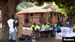 A man votes at a polling station in Bissau, April 13, 2014. 