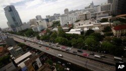 FILE - Cars cross the Thai-Japanese friendship bridge in Bangkok, Thailand.