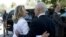 Israel's President Shimon Peres, right, walks U.S. Secretary of State Hillary Clinton, to her car following their meeting in Jerusalem, July 16, 2012. 